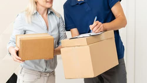 A person picking up a parcel delivery.