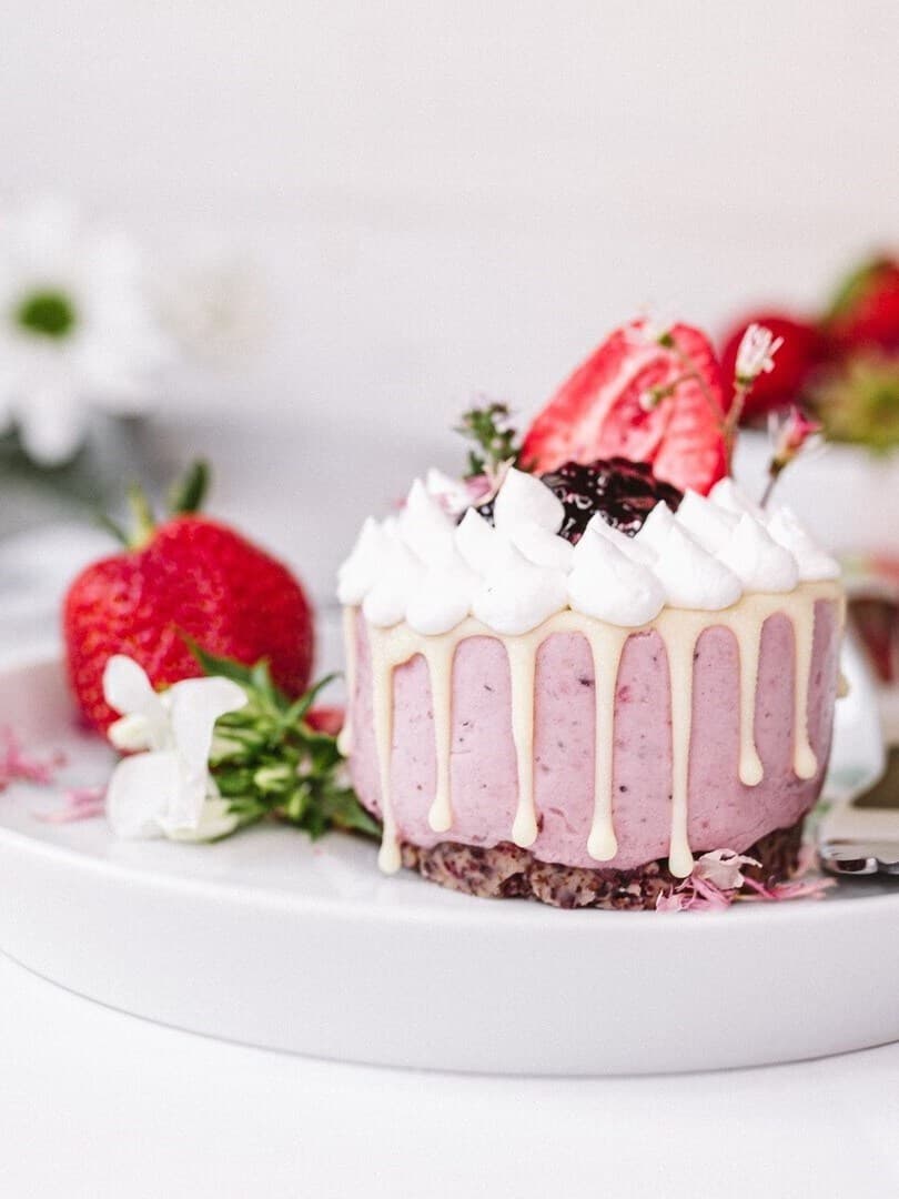 A plate with a vegan and gluten-free berry tartlet.