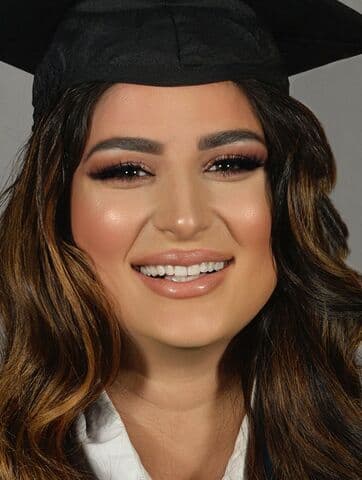 A portrait of Aya in a graduation cap.