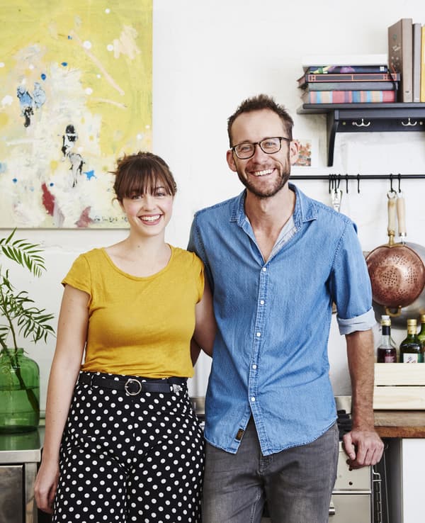 A portrait of Kyra and Dave in their kitchen.