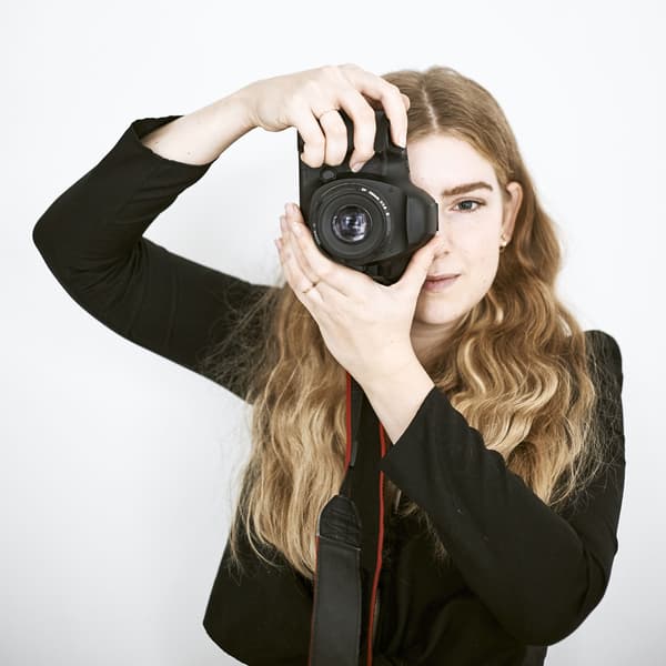 A portrait of Yvet with her camera.