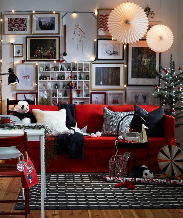A red, black and white living room with festive decorations.