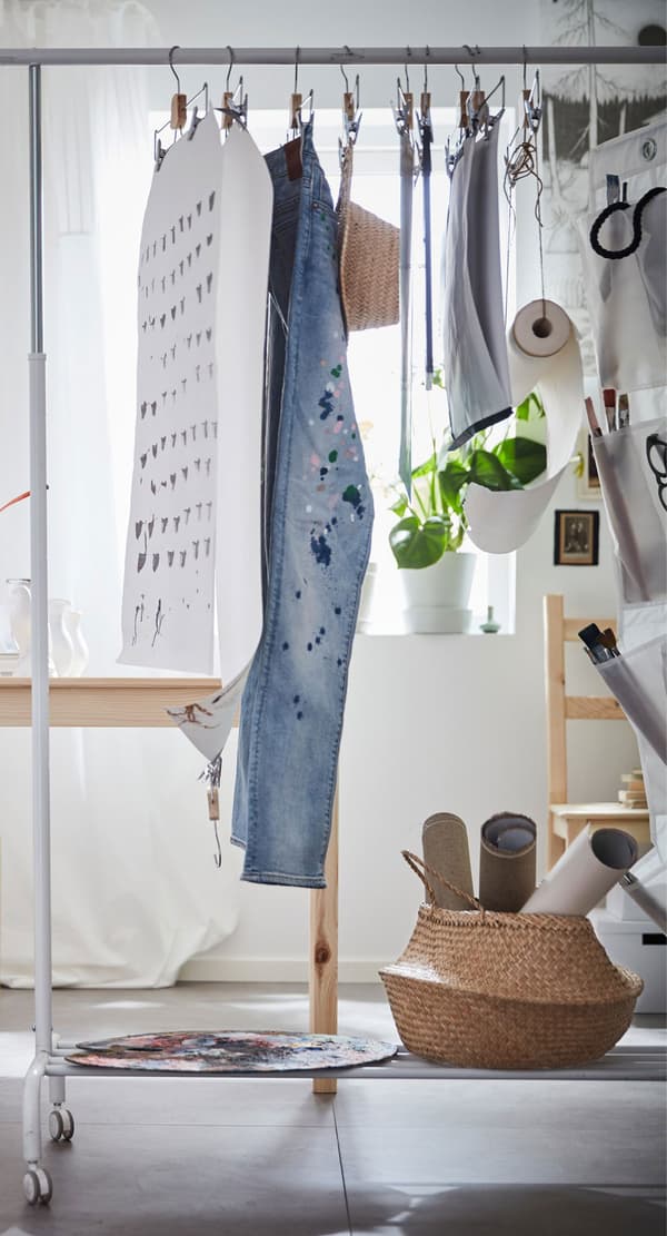 A RIGGA clothes rack is multitasking dorm room furniture. It’s storing clothes, displaying art, and organising.