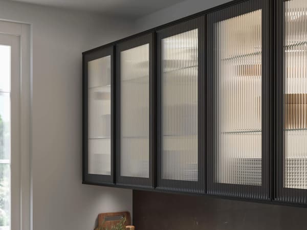 A set of glass doors with a black frame in a kitchen,