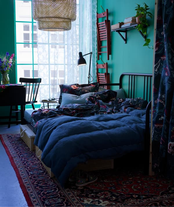 A shared space like a kitchen makes a seamless transition from day to night with an IKEA FYRESDAL daybed.