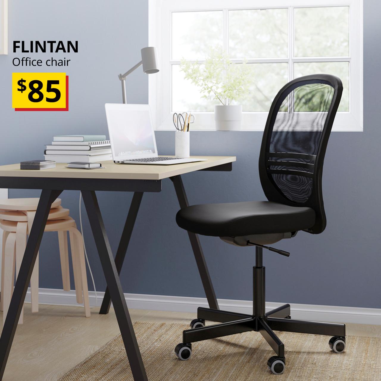 A side angle of a black FLINTAN office chair in a study room setting.  On the top left corner, a black text overlay image that reads, "FLINTAN, Office chair", followed by a yellow/red tag with black text that states, "$85"
