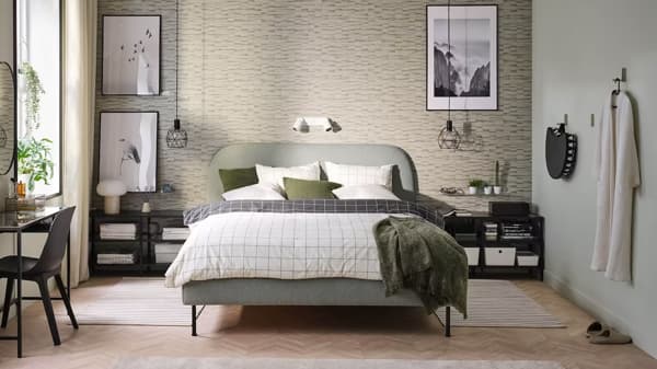 A soft bed surrounded by IKEA furniture, plants, decor, accessories and more