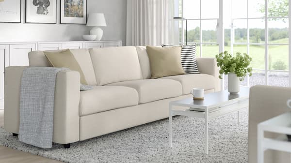 A spacious living room decorated with IKEA furniture.