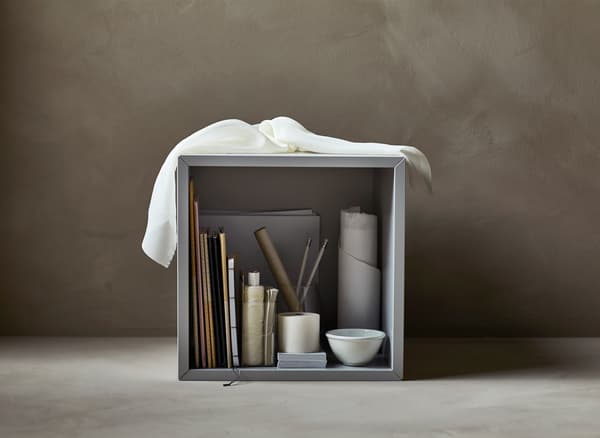 A storage cube filled with art supplies