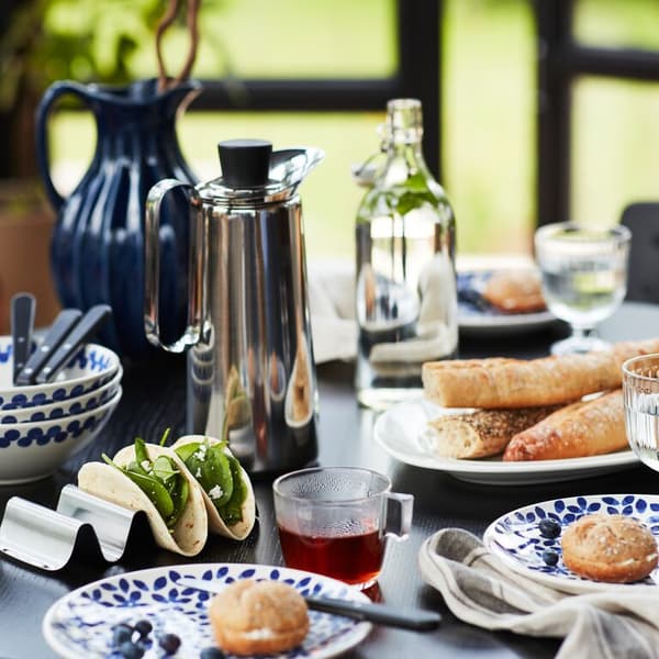 A table set for brunch with SMÅKALLT serving stand and MEDLEM tableware.
