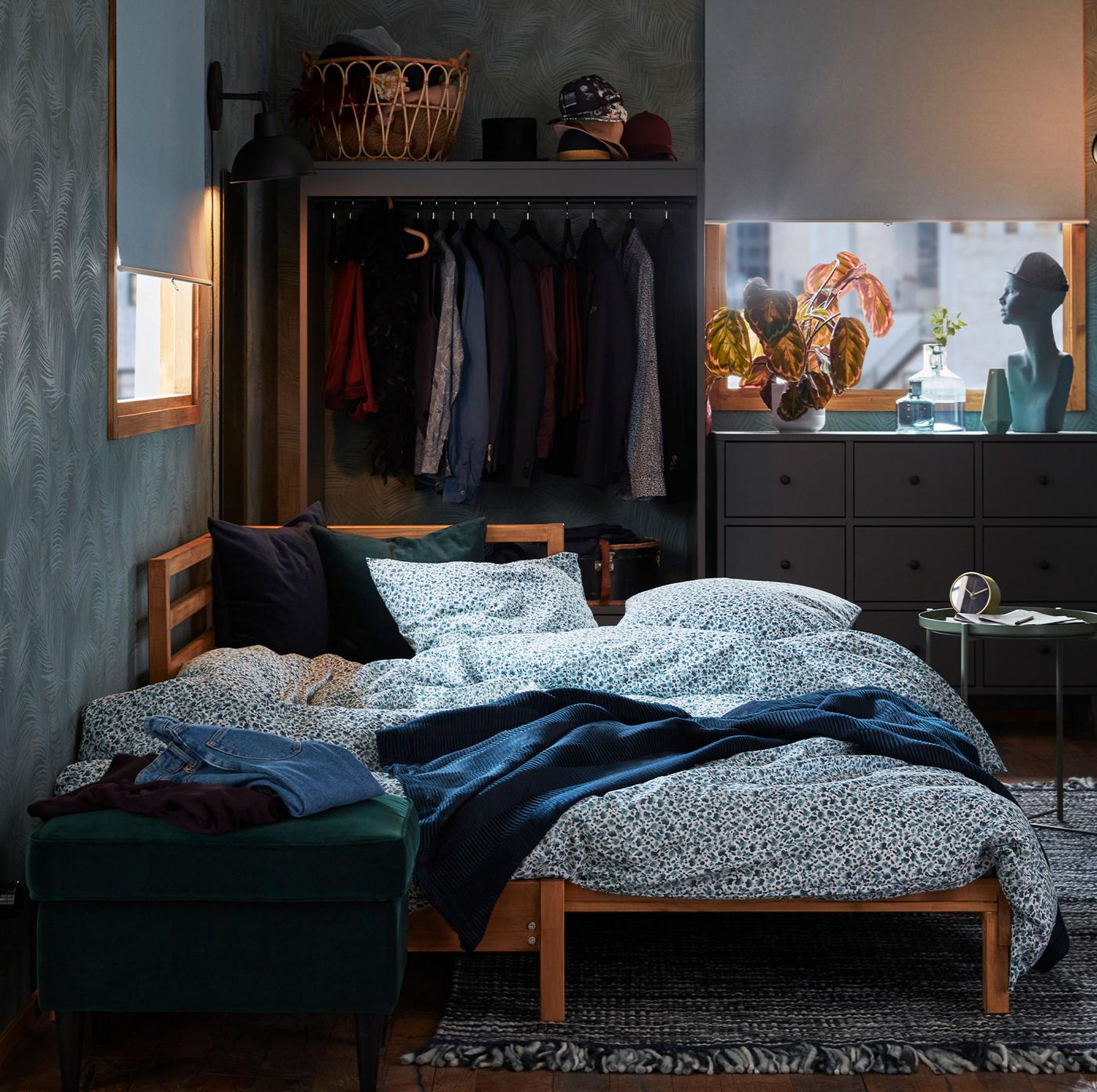 A TARVA bedroom with a bed and curtains.