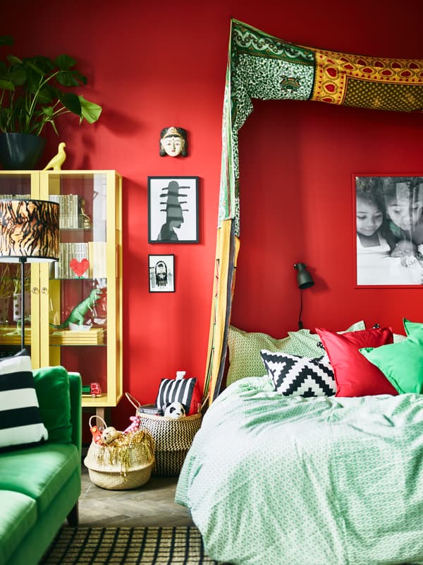 A textile canopy helps give this stylist’s bedroom its distinctive look.