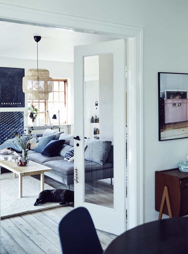A white, bright living and dining space.