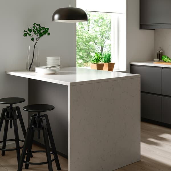 A white KASKER custom countertop in a small kitchen