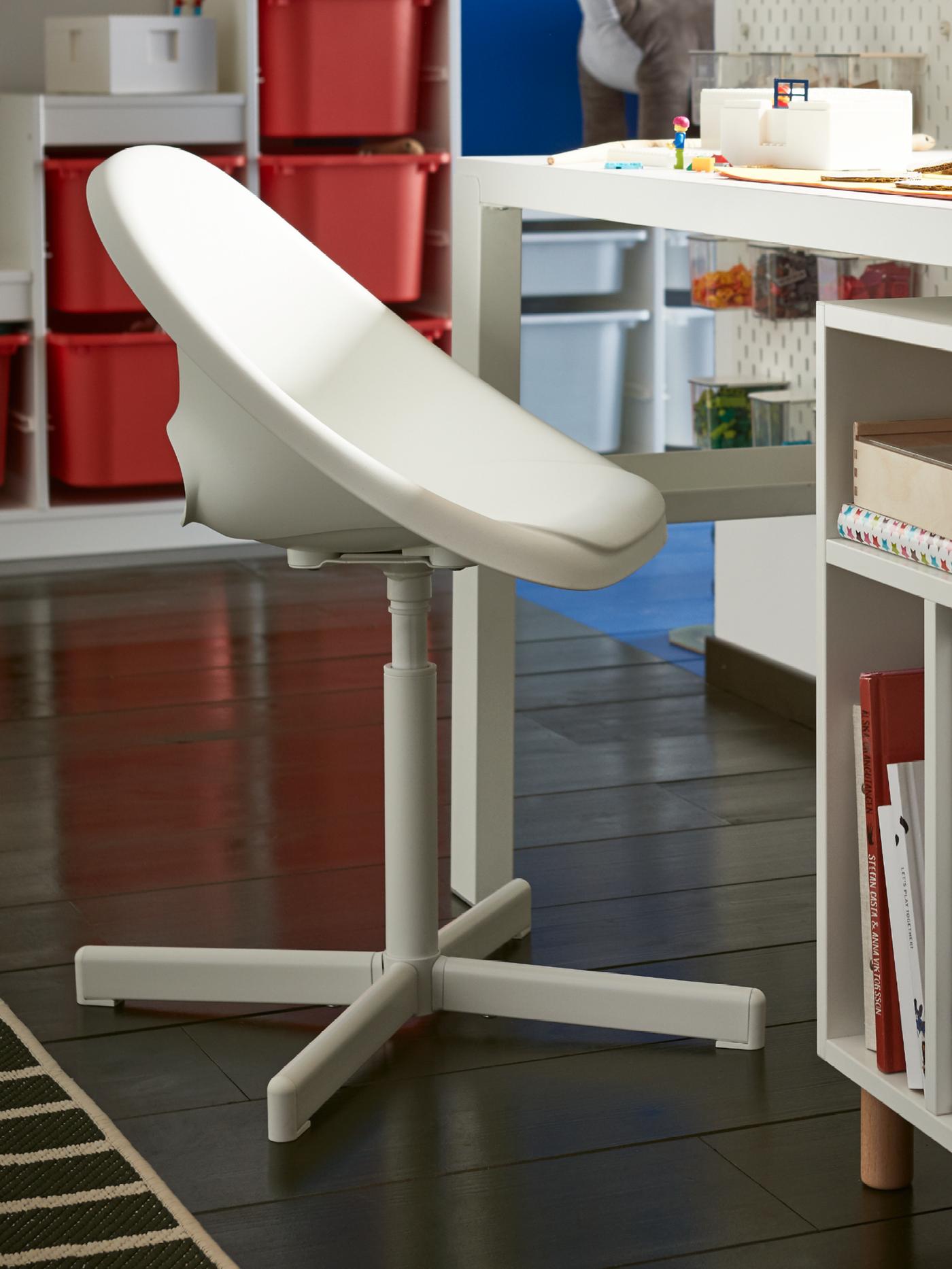 A white SKÅDIS pegboard in the childrens room
