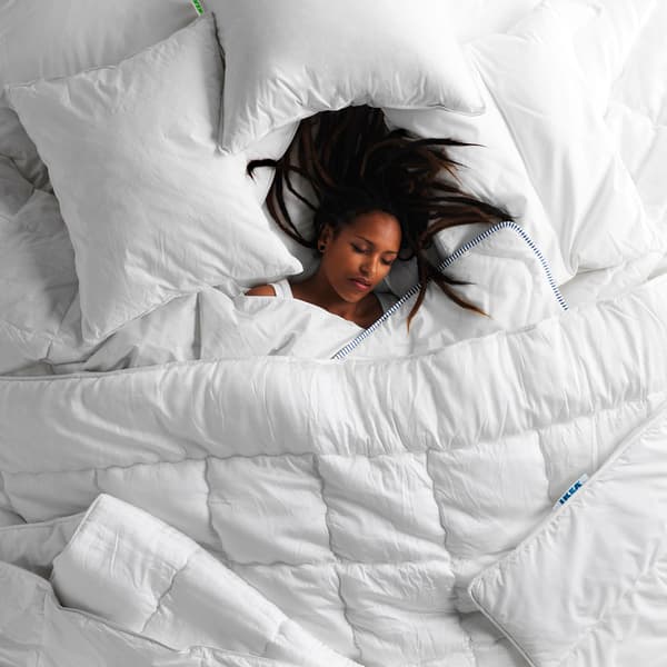 A woman asleep on her back.