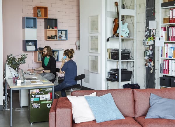 Adam and Deborah working in their home office.