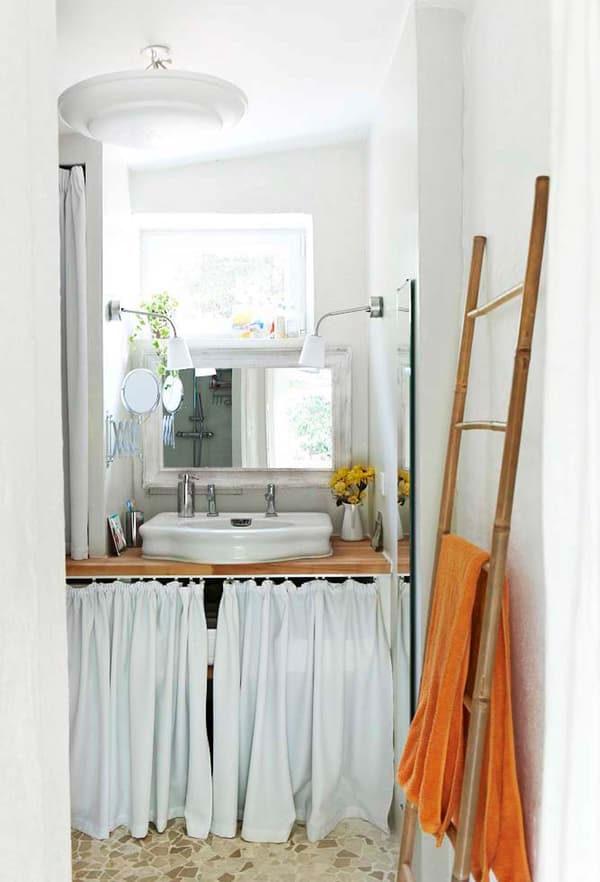 Add a fabric curtain to hide modern bathroom essentials.