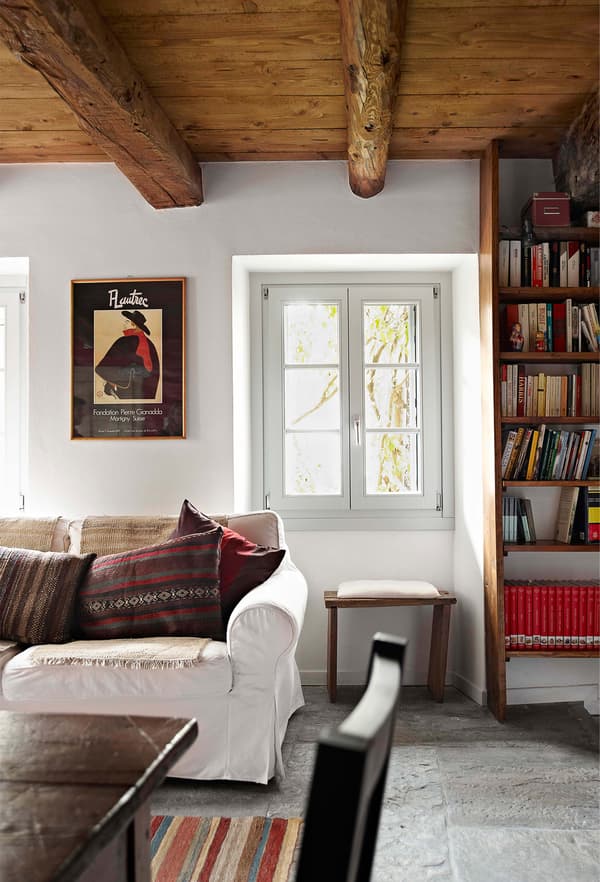 Add colour with scatter cushions and rugs.