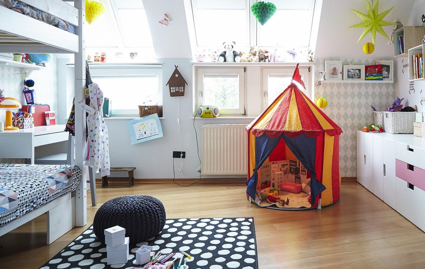 Adding a rug to a kid’s bedroom creates a comfy space to play.