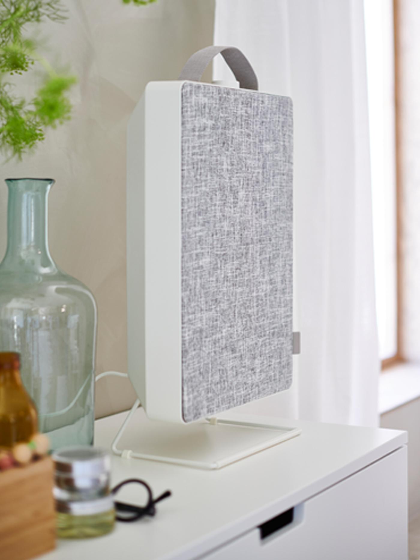 Air purifier on chest of drawers