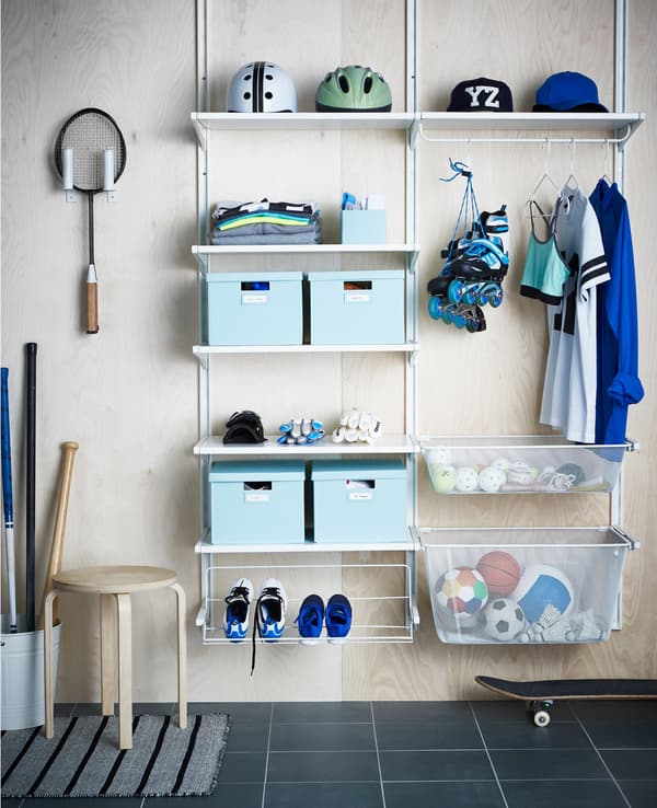 An ALGOT storage system filled with sports equipment and storage boxes.
