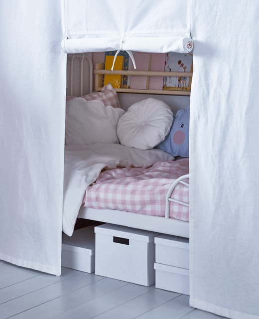 An animated GIF showing a kid’s bed curtain rolling up.
