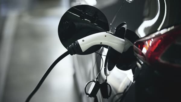 An electric car plugged into a charging station