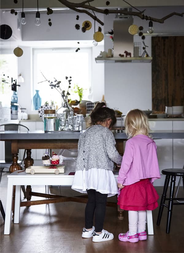 An IKEA bench makes a great pretend countertop for children to get hands-on in the kitchen or simply play alongside