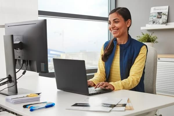 An IKEA co-worker from the customer service team working at his desk.