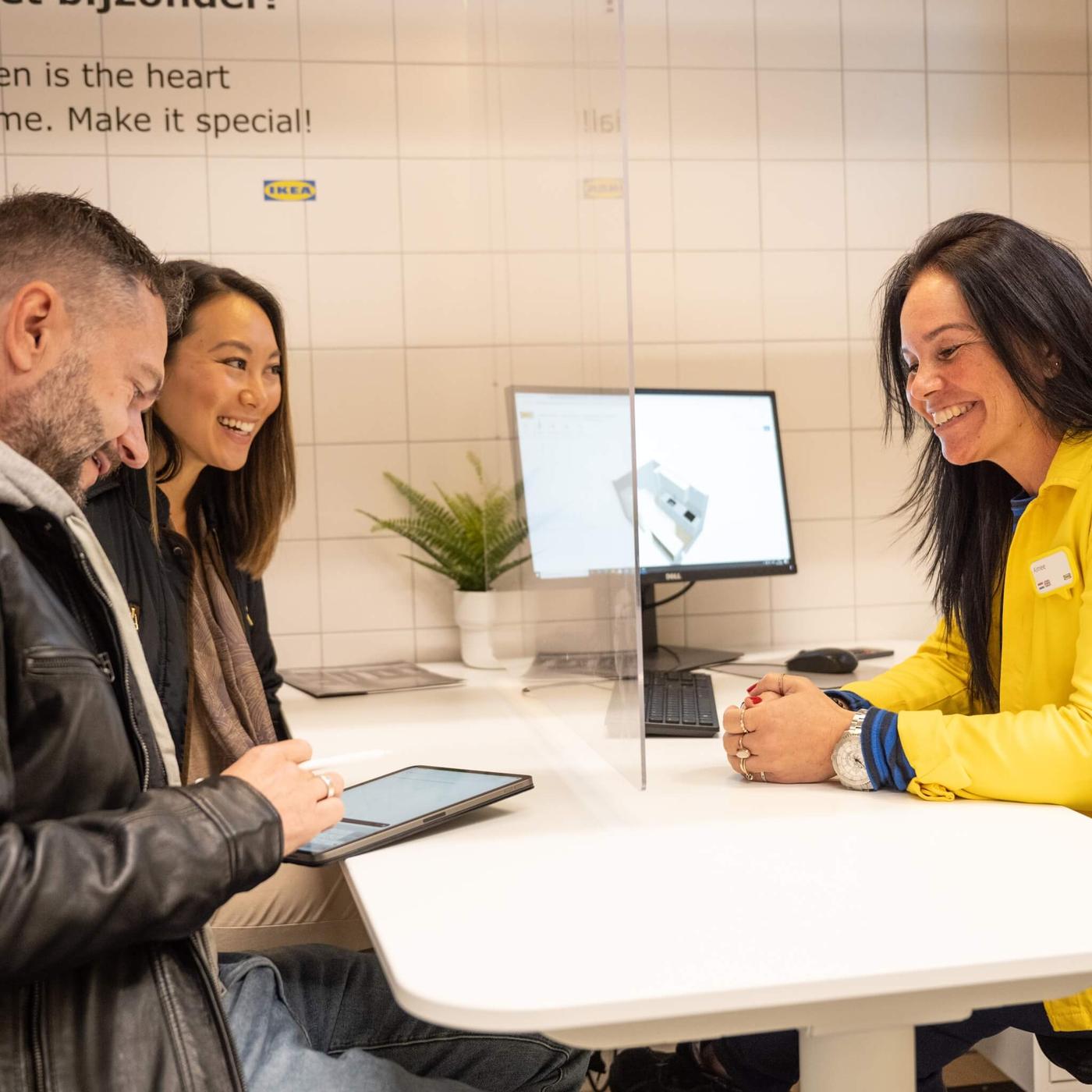 An IKEA co-working planning with two customers.