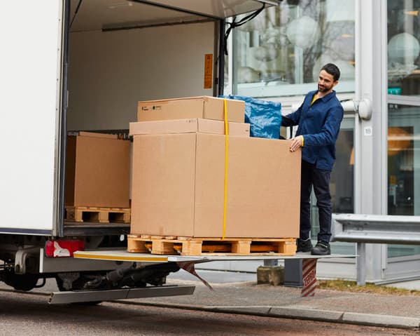 An IKEA coworker delivering an order