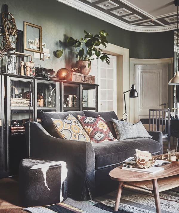 An IKEA FÄRLÖV 2-seat sofa in grey velvet in a living room packed with personality.