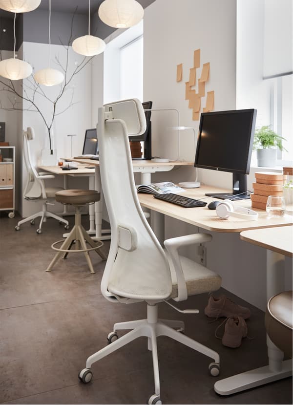 An IKEA JÄRVFJÄLLET ergonomic swivel work chair, with armrests and adjustable headrest, lumbar and seat height.