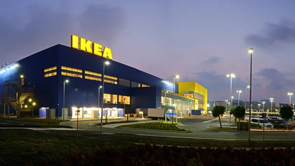 An illuminated IKEA store at dusk