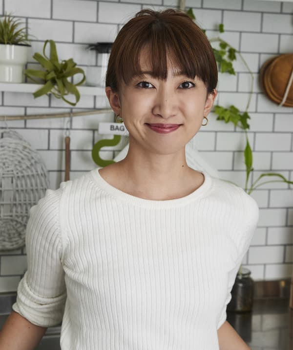 An image of a woman in her kitchen.