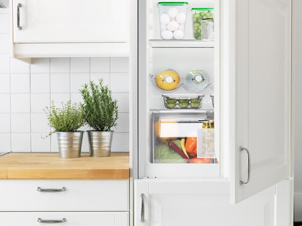 An open integrated fridge in the kitchen