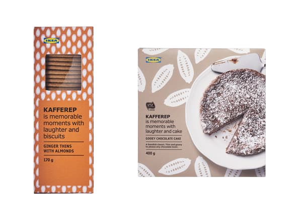 An orange box of biscuits and a brown box with a chocolate cake on the front.