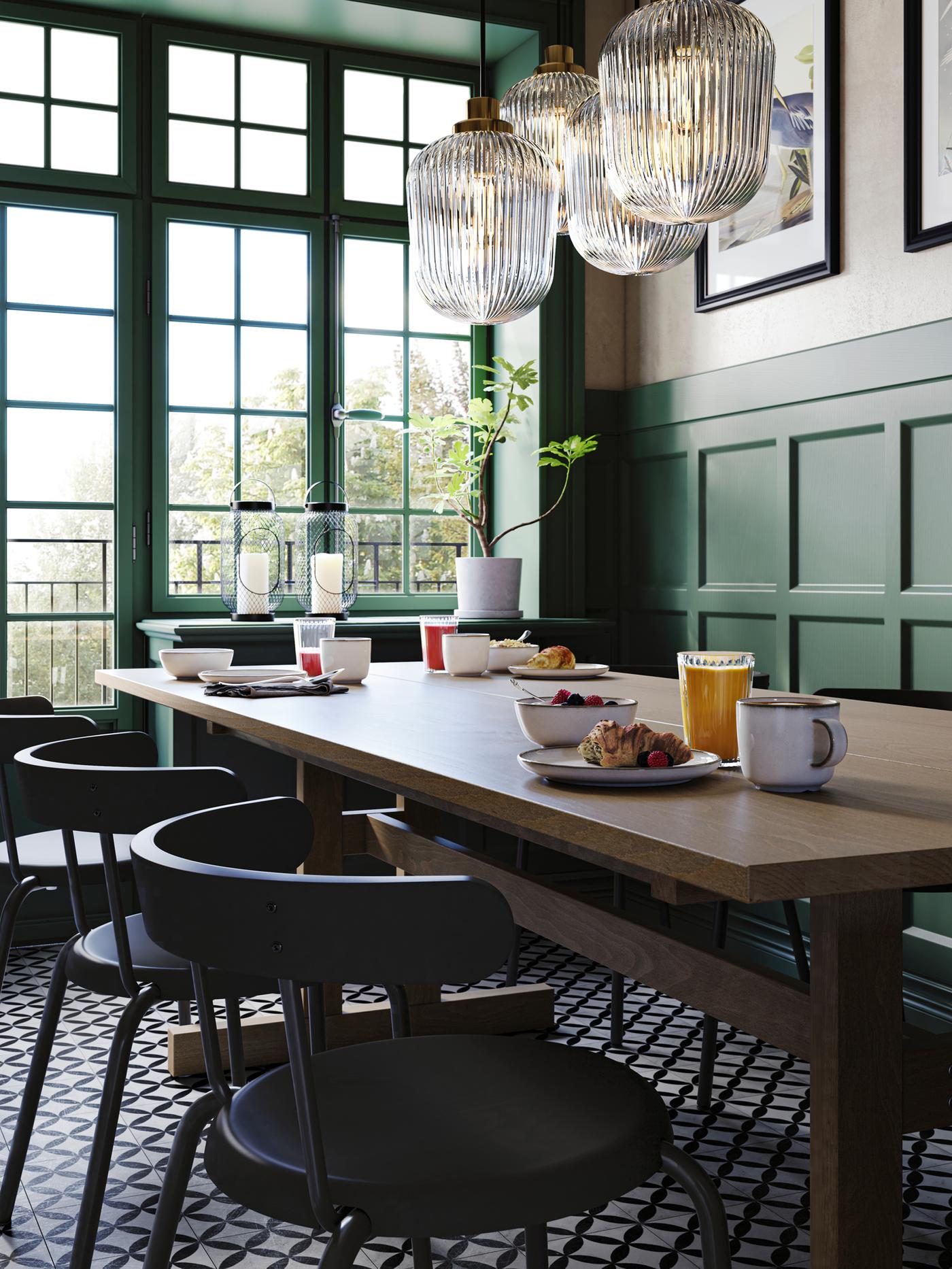 Anthracite YNGVAR chairs round a grey-brown KLIMPFJÄLL dining table in a green restaurant interior with large paned windows.
