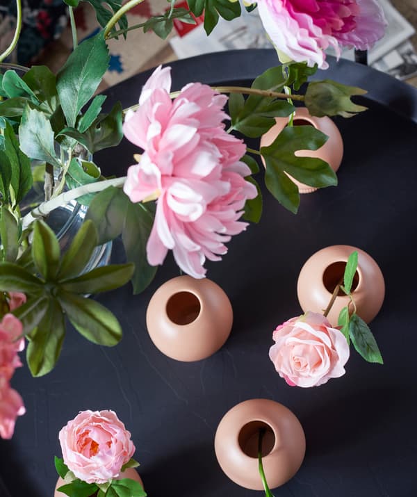Artificial flowers like IKEA SMYCKA balance balance and beauty to a creepily themed space.