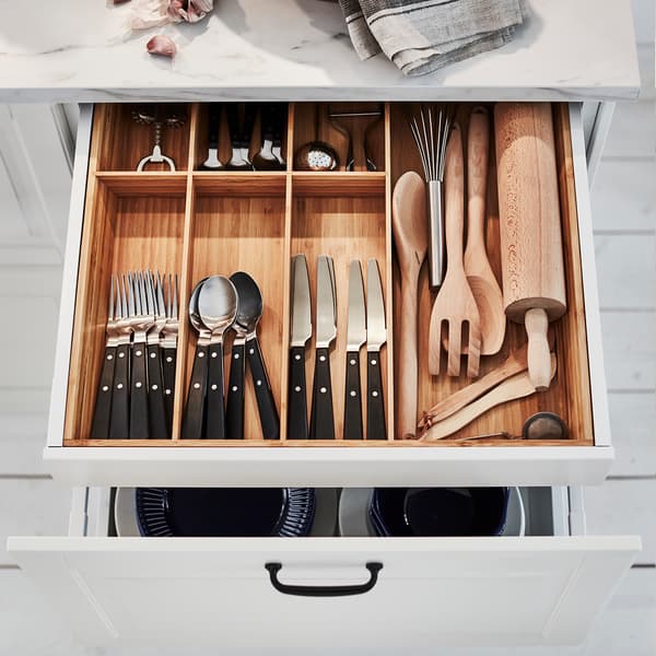 Bamboo VARIERA flatware tray filled with cutlery and utensils.
