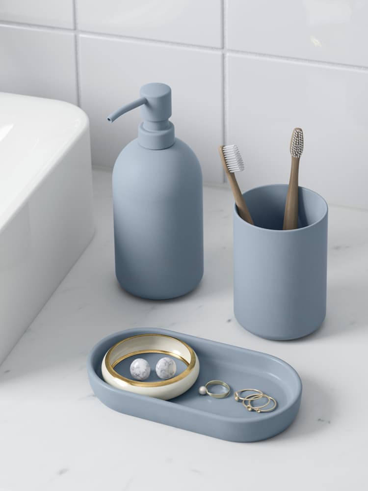 Bathroom accessories for toothbrush and soap.