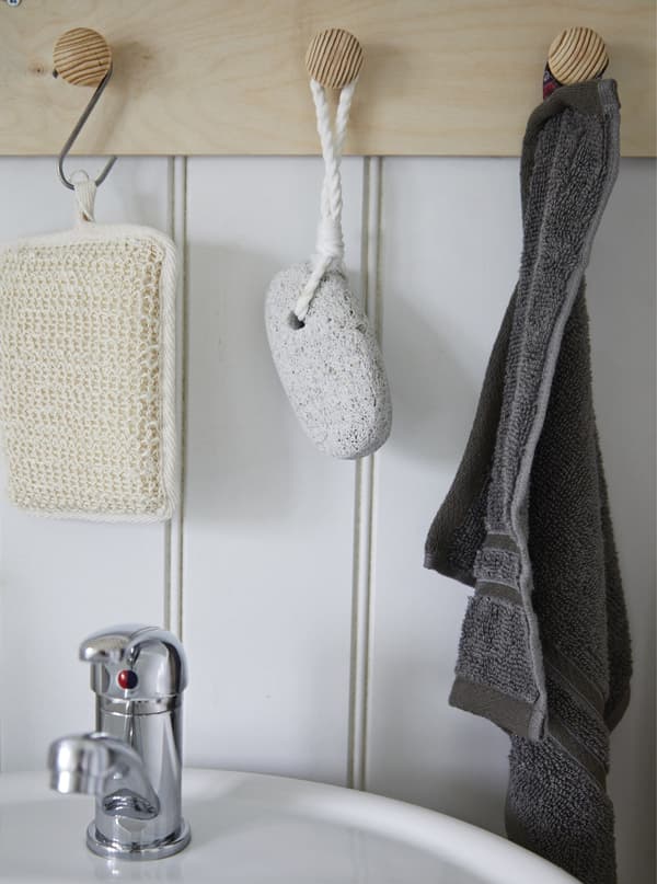 Bathroom accessories hanging on hooks.