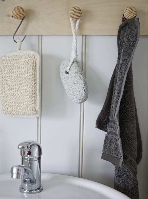Bathroom accessories hanging on hooks.
