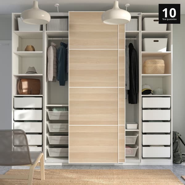 Bedroom showcasing a PAX wardrobe with grey Flornes doors