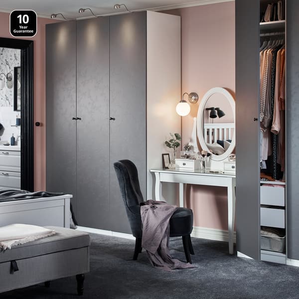 Bedroom showcasing a PAX wardrobe with grey Flornes doors