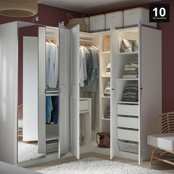 Bedroom showcasing a White PAX wardrobe with white Grimo doors