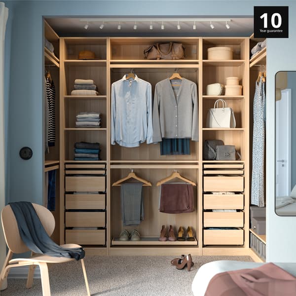 Bedroom showcasing a white wardrobe without doors