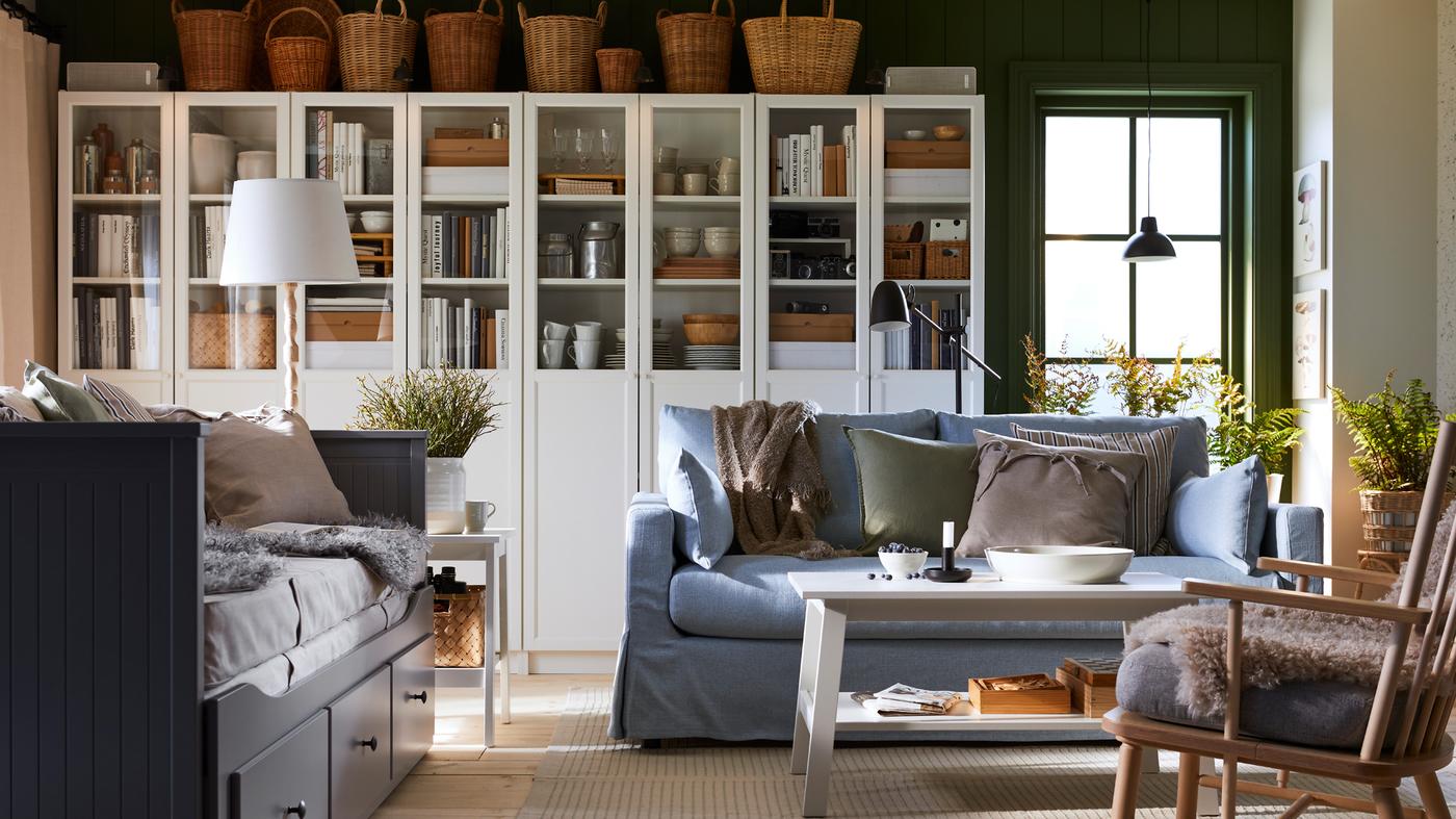 BILLY bookcases and a HYLTARP 2-seat sofa are in a traditional-style living room inspired by Nordic cottages.