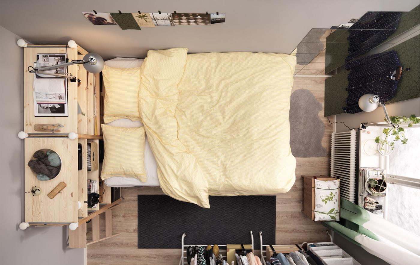 Bird's-eye view of a small bedroom for two with a platform bed and lots of storage.